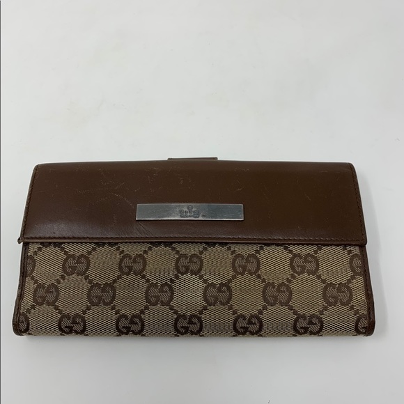 Gucci Handbags - Gucci brown GG leather canvas trifold wallet